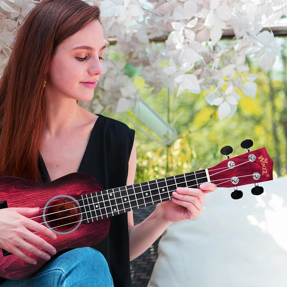Winzz Ukulele Soprano dla dzieci, zestaw startowy dla początkujących - 21” z 6 akcesoriami (torba na ukulele, tuner, struny Aquila, naklejki na podstrunnicę, pasek, ściereczka do czyszczenia)